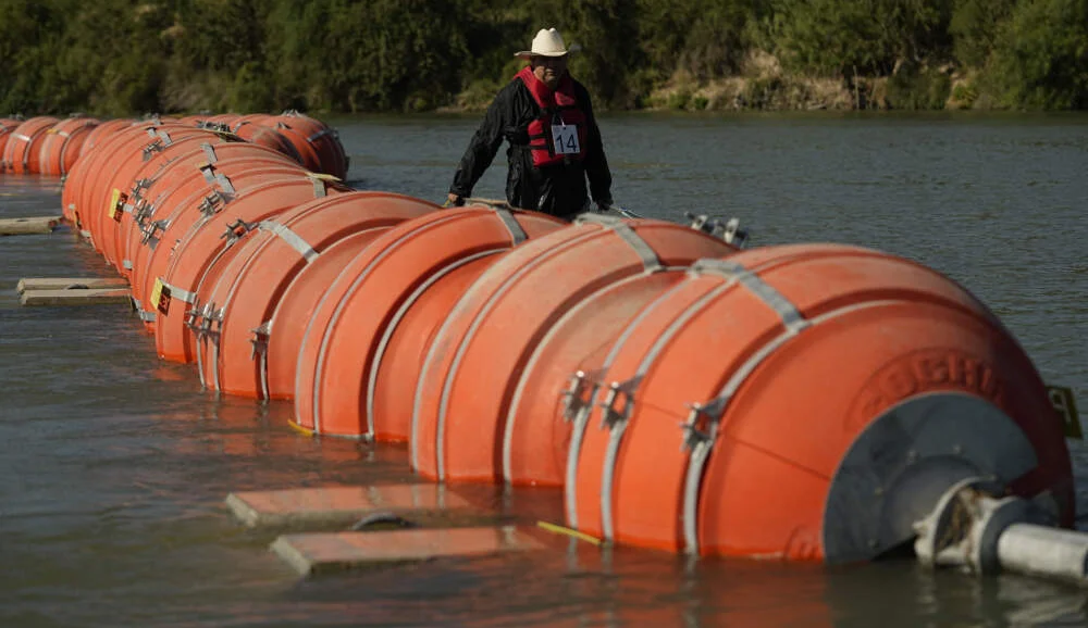 Federal judge rules against Texas Gov. Abbott's floating barrier in Rio